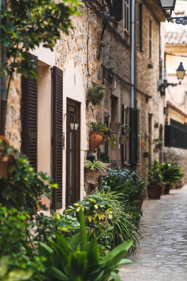 Picturesque cobblestone street between old stone buildings