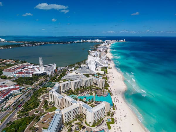 Hotels and resorts lining the sea coast seen from above
